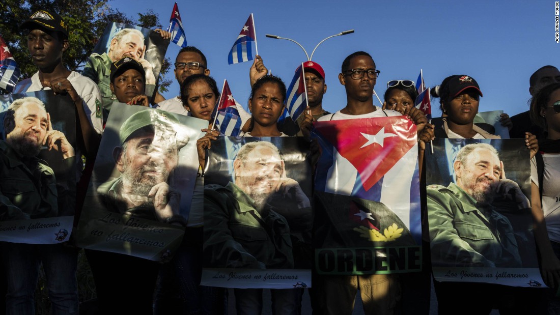 Cuban government supporters chant for Fidel Castro near the entrance of the cemetery on December 4. 