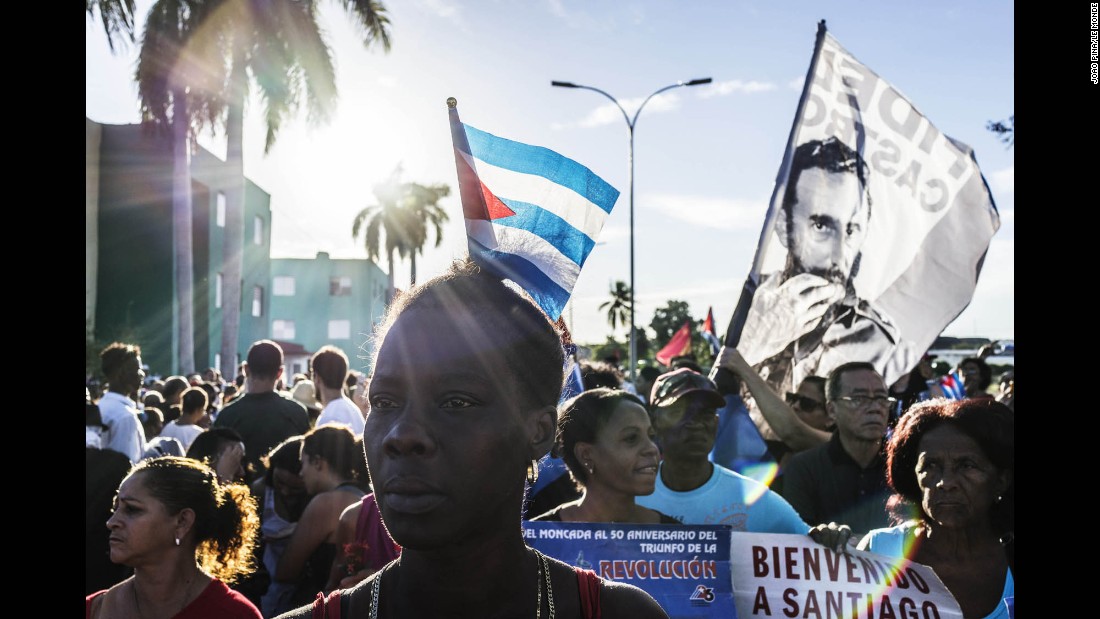 Cuban government supporters chant for Fidel Castro near the entrance of the cemetery on December 4. 