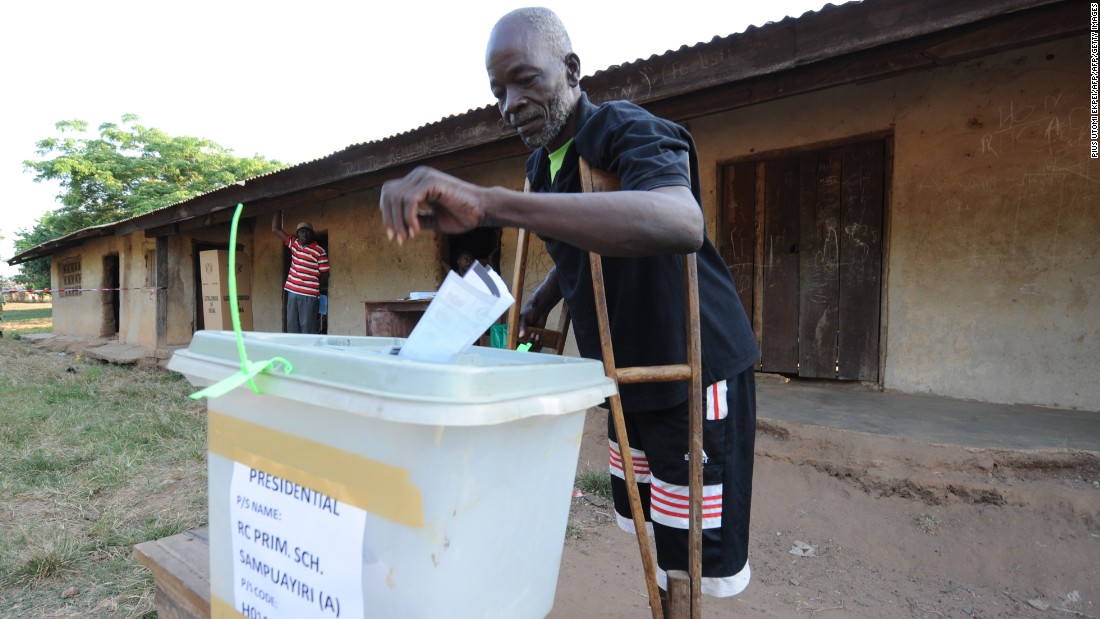 A man on crutches casts his vote at Talekura, Bole Bamboi constituency, in a northern region on December 7, 2012 during the presidential elections