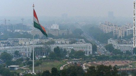 In this photograph taken on February 24, 2015, shows the Indian tri-colour as it flies over Connaught Place in New Delhi, ahead of World Environment Day which falls on June 5.   The Indian government is under intense pressure to act after the World Health Organization last year declared New Delhi the world&#39;s most polluted capital.  At least 3,000 people die prematurely every year in the city because of air pollution, according to a joint study by Boston-based Health Effects Institute and Delhi&#39;s Energy Resources Institute.  AFP PHOTO / CHANDAN KHANNA        (Photo credit should read Chandan Khanna/AFP/Getty Images)