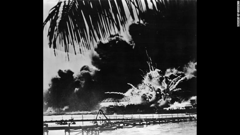 Smoke and flames rise from the USS Shaw in Pearl Harbor after the Japanese attack on December 7, 1941. The Japanese Imperial Navy launched the surprise strike on the US naval base at the harbor, located on the Hawaiian island of Oahu. The assault killed more than 2,000 Americans and destroyed a significant number of US battleships and airplanes.