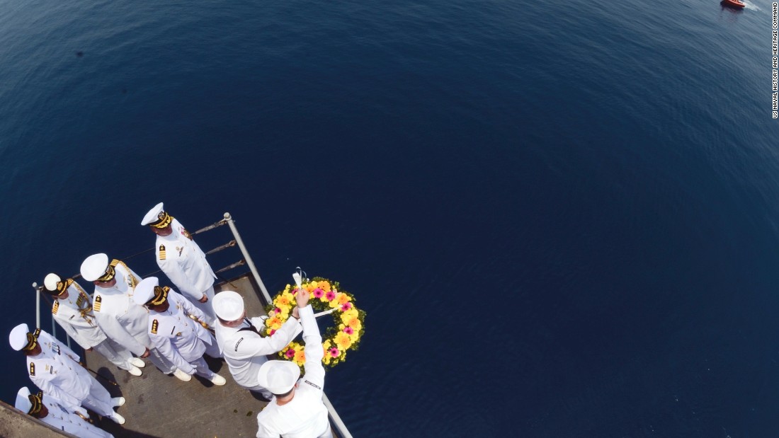 US sailors lower a wreath in the area the ships sank on the 73rd anniversary of the Battle of the Sunda Strait. 