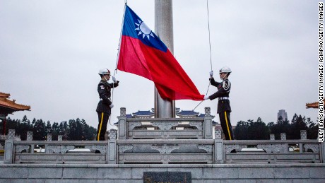 TAIPEI, TAIWAN - JANUARY 14:  Honor guards raise the Taiwan flag in the Chiang Kai-shek Memorial Hall square ahead of the Taiwanese presidential election on January 14, 2016 in Taipei, Taiwan. Voters in Taiwan are set to elect Tsai Ing-wen, the chairwoman of the opposition Democratic Progressive Party, to become the island&#39;s first female leader.  (Photo by Ulet Ifansasti/Getty Images)