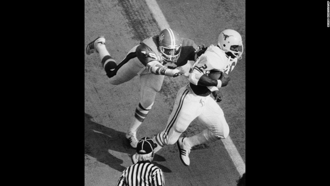 Earl Campbell of the University of Texas runs with the football during a 1977 game against the University of Houston.