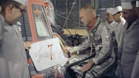 Astronaut John Glenn inspects artwork that will be painted on the outside of his Mercury spacecraft, which he nicknamed Friendship 7. On Feb. 20, 1962, Glenn lifted off into space aboard his Mercury Atlas (MA-6) rocket to become the first American to orbit the Earth. After orbiting the Earth 3 times, Friendship 7 landed in the Atlantic Ocean, just East of Grand Turk Island in the Bahamas. Glenn and his capsule were recovered by the Navy Destroyer Noa, 21 minutes after splashdown.

Image Credit: NASA