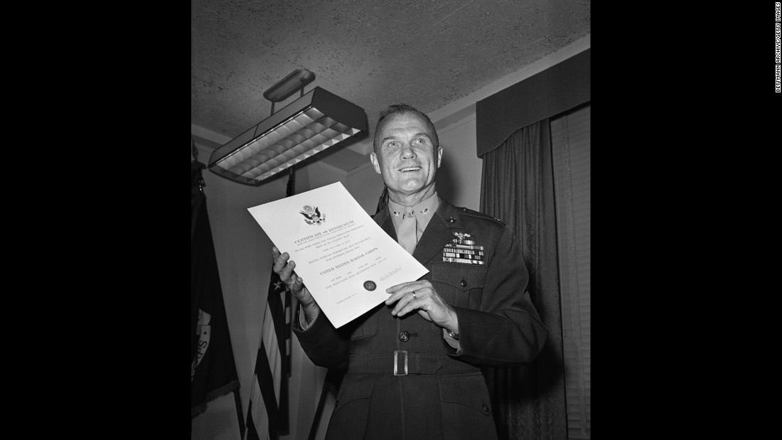 Glenn holds his discharge papers after he retired from the Marine Corps and resigned from NASA&#39;s astronaut program. Now a national figure, he went on to become an executive for the Royal Crown Cola Co. He would soon explore a career in politics.