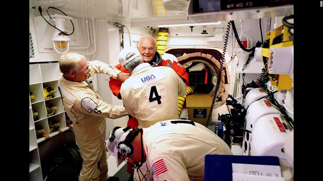 On October 29, 1998, Glenn, then 77, became the &lt;a href=&quot;http://www.cnn.com/TECH/space/9811/02/shuttle.02/index.html?iref=allsearch&quot; target=&quot;_blank&quot;&gt;oldest person to venture into space.&lt;/a&gt; Here, he has his flight suit checked before climbing into the space shuttle Discovery. His second flight into space came 36 years after his legendary Mercury launch.