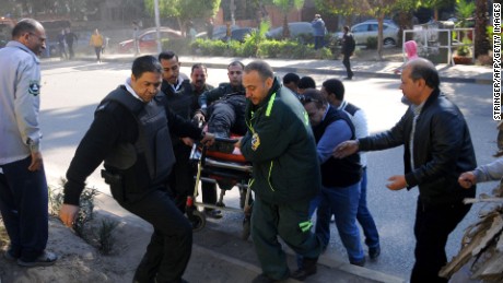 Emergency services transport a bomb attack victim west of Cairo.