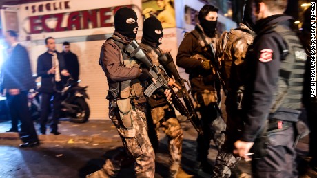 Turkish special police officers patrol streets after a car bomb exploded near the stadium.