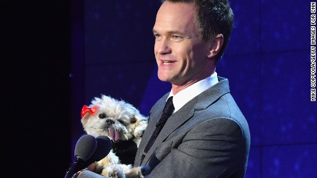 NEW YORK, NY - DECEMBER 11:  Neil Patrick Harris wirth a dog, speaks onstage during the CNN Heroes Gala 2016 at the American Museum of Natural History on December 11, 2016 in New York City. 26362_011  (Photo by Mike Coppola/Getty Images for Turner)