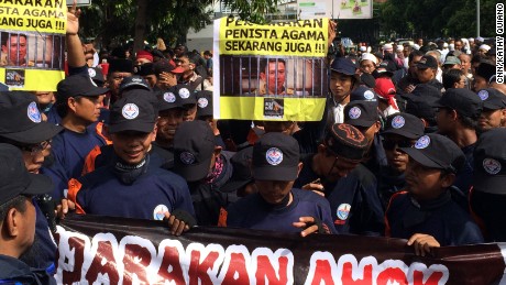 Anti-Ahok protestors gather outside a Central Jakarta courthouse, where the mayor is on trial for blasphemy.