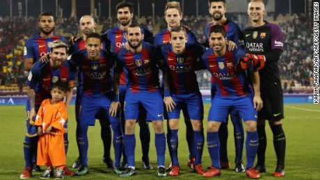 Murtaza Ahmadi poses with the Barcelona team before its game against Saudi Arabia&#39;s Al-Ahli.