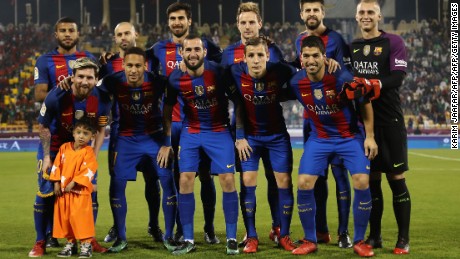 Murtaza Ahmadi poses with Lionel Messi and FC Barcelona in Doha in December 2016. 