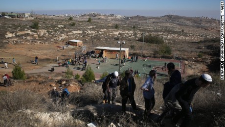 Young Israeli settlers gather in the settlement outpost of Amona, which was established in 1997, in the Israeli-occupied West Bank on December 9, 2016.
Hundreds of supporters of Israel&#39;s settler movement arrived at the outpost, where some 40 families live, to protest against the Israeli high court order to demolish the place by December 25 because it was built on private Palestinian land. / AFP / - / MENAHEM KAHANA        (Photo credit should read MENAHEM KAHANA/AFP/Getty Images)