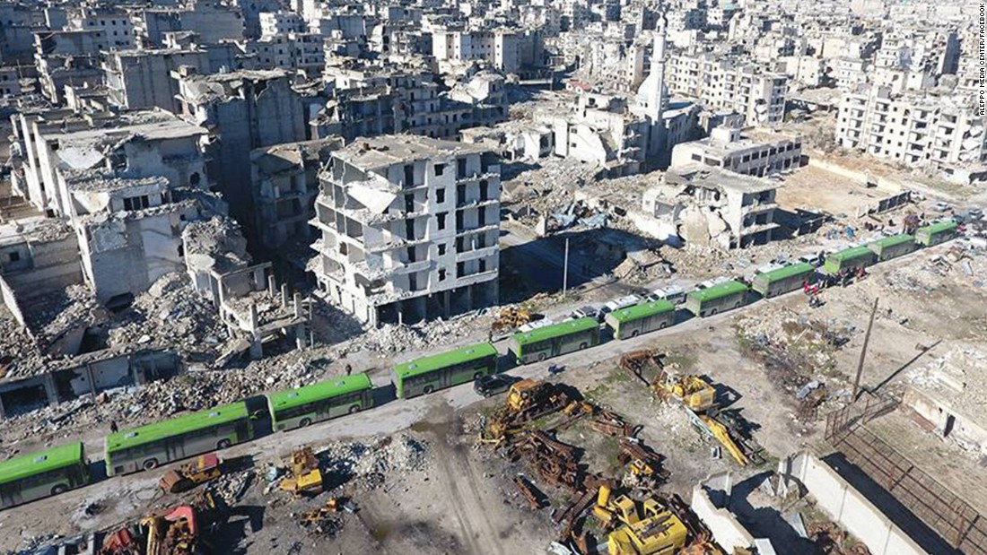 Buses line up to transport people away from eastern Aleppo on December 15.