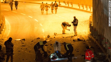 ISTANBUL, TURKEY - DECEMBER 10:  (EDITOR&#39;S NOTE: Image contains graphic content) Forensic policemen and officers attend the scene following a twin suicide bomb attack near to  Besiktas Vodaphone Arena on December 10, 2016 in Istanbul, Turkey. According to reports, at least 13 people were killed by a twin suicide bomb attack near to the Besiktas Vodaphone Arena, which is believed to have been targeting riot police. (Photo by Kurtulus Ari /Getty Images)