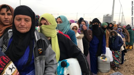 Hundreds spend their day lining up for supplies; it is cold, and people&#39;s patience is wearing thin.