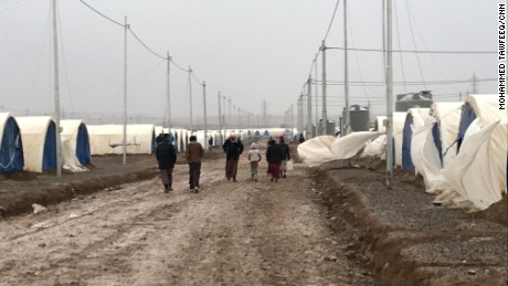 Refugees head to the camp where they live in tents provided by the UN.