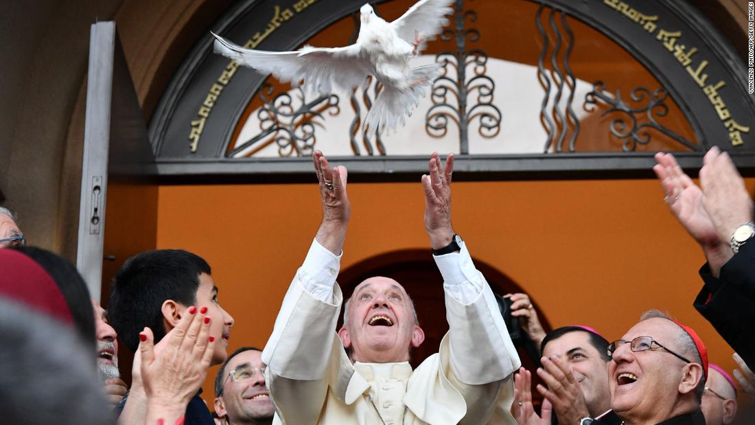 Pope Francis looks on with joy as he releases a dove as a symbol of peace during a meeting with the Assyrian Chaldean community at the Catholic Chaldean Church of St. Simon Bar Sabbae in Tbilisi, Georgia, on September 30, 2016.