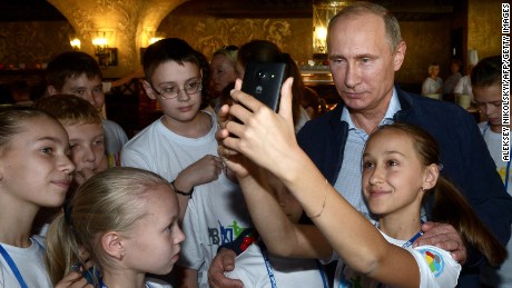 Putin poses for selfie during his visit to the National Children&#39;s Sports and Health Centre in Sochi on October 11, 2014. 