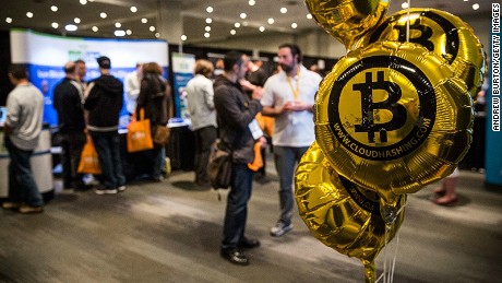 People attend a Bitcoin conference in New York.