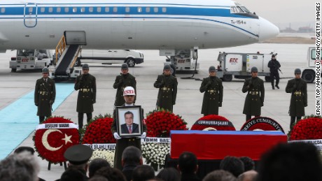 Turkish soldiers stand near the coffin of the Russian ambassador Tuesday at the Ankara airport.