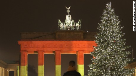 BERLIN, GERMANY - DECEMBER 20:  The Brandenburg Gate stands illuminated in the colors of the German flag the day before a truck drove into a crowded Christmas market in the city center on December 20, 2016 in Berlin, Germany. So far 12 people are confirmed dead and 45 injured. Authorities have confirmed they believe the incident was an attack and have arrested a Pakistani man who they believe was the driver of the truck and who had fled immediately after the attack. Among the dead are a Polish man who was found on the passenger seat of the truck. Police are investigating the possibility that the truck, which belongs to a Polish trucking company, was stolen yesterday morning.  (Photo by Sean Gallup/Getty Images)