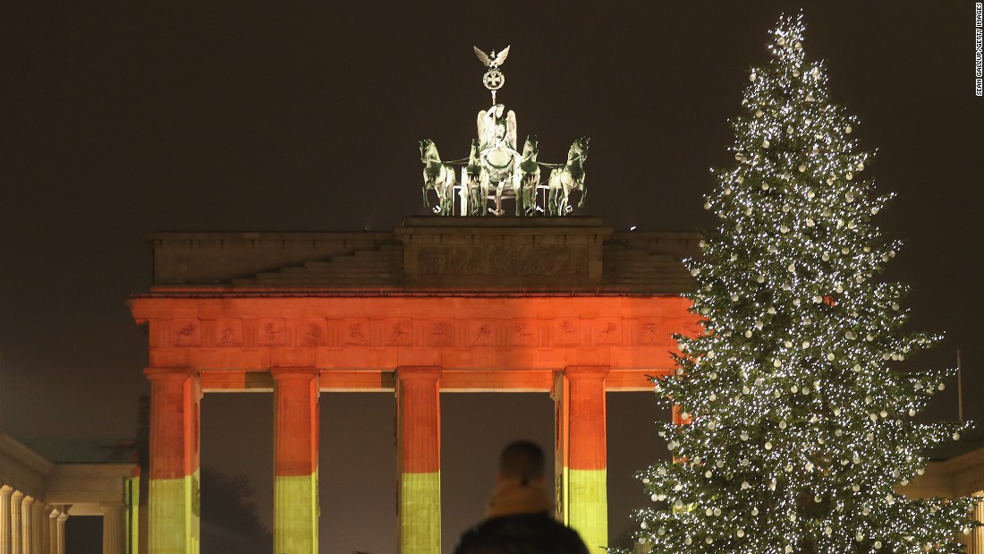 The Brandenburg Gate in Berlin is illuminated in the colors of the German flag on Tuesday, December 20, one day after &lt;a href=&quot;http://www.cnn.com/2016/12/19/europe/gallery/berlin-market-attack/index.html&quot; target=&quot;_blank&quot;&gt;a truck crashed into a crowded Christmas market&lt;/a&gt; there. At least 12 people were killed and 48 injured in what police are investigating as a terrorist attack.