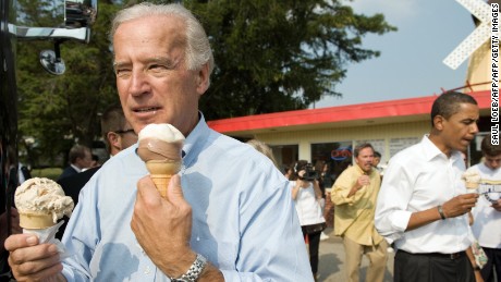 US vice presidential nominee Senator Joe Biden (L) and Democratic presidential nominee Senator Barack Obama (R) enjoy ice cream cones as they speak with local residents at the Windmill Ice Cream Shop in Aliquippa, Pennsylvania, August 29, 2008. AFP PHOTO / SAUL LOEB (Photo credit should read SAUL LOEB/AFP/Getty Images)