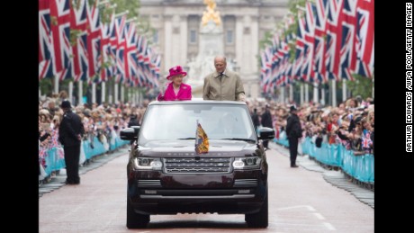 The Queen and Prince Philip wave to guests attending celebrations in London for her 90th birthday in 2016.