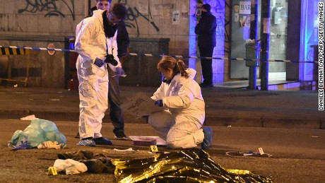 Italian police and forensics experts gather around the body of suspected Berlin truck attacker Anis Amri after he was shot dead in Milan on December 23, 2016.  
The Tunisian man suspected of carrying out the deadly Berlin truck attack at the Christmas market was shot dead by police in Milan on December 23, Italy&#39;s interior minister Marco Minniti said. The minister told a press conference in Rome that Anis Amri had been fatally shot after firing at two police officers who had stopped his car for a routine identity check around 3:00 am (0200 GMT). Identity checks had established &quot;without a shadow of doubt&quot; that the dead man was Amri, the minister said. / AFP / DANIELE BENNATI        (Photo credit should read DANIELE BENNATI/AFP/Getty Images)