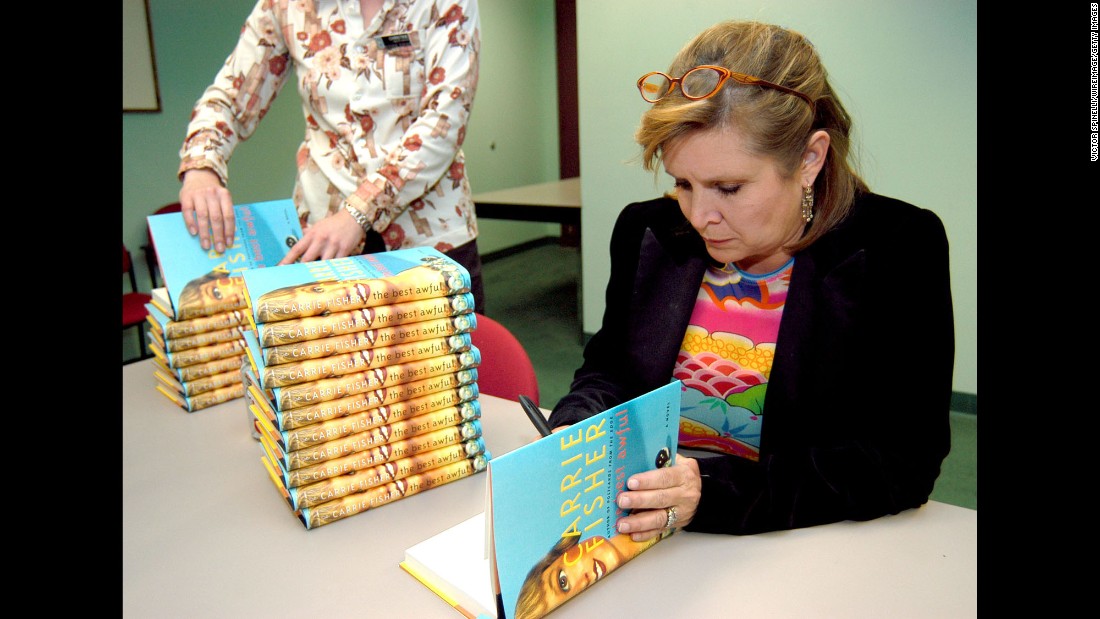 Fisher attends a book signing for her novel, &quot;The Best Awful,&quot; in Beverly Hills, California, in 2004. The semi-autobiographical novel fictionalized events from Fisher&#39;s life. 
