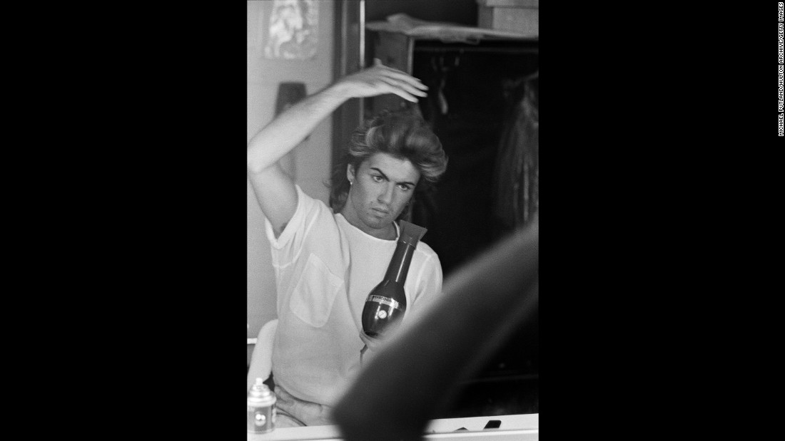 Michael blow-dries his hair while on Wham!&#39;s 1985 world tour. The band made stops in the UK, Japan, Australia, and China.