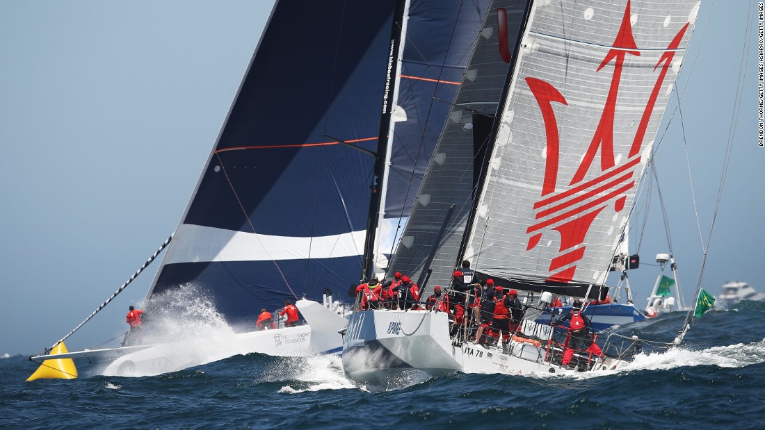 The fourth supermaxi in the fleet was CQS -- formerly the 90-foot Nicorette rebuilt in New Zealand for Finnish owner Ludde Ingvall, a two-time line honors winner of the race. It finished seventh. Here CQS (left) heads out to sea with the 70-foot Maserati, which crossed sixth as both boats were becalmed for hours in the Derwent River when the wind died.