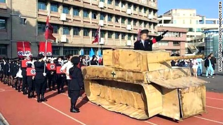 Some students waved a Nazi flag and shouting &#39;Sief Heil&#39; while a history teacher - dressed as Hitler and standing in a tank made with cardboard - saluted the &#39;Nazi soldiers&#39;.