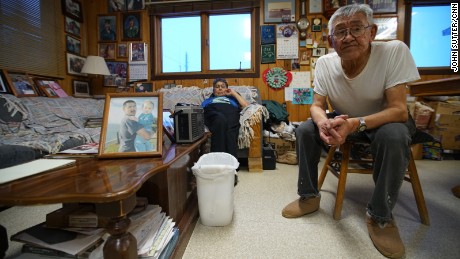 Shelton and Clara Kokeok, with a photo of their deceased son, Norman, who fell through the ice in 2007.