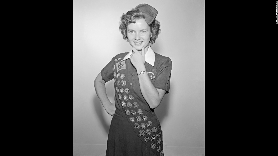 Reynolds was a proud member of the Girl Scouts.  At the time of this photo, at age 17, she had earned 42 out of a possible 100 badges in eight years of scouting.