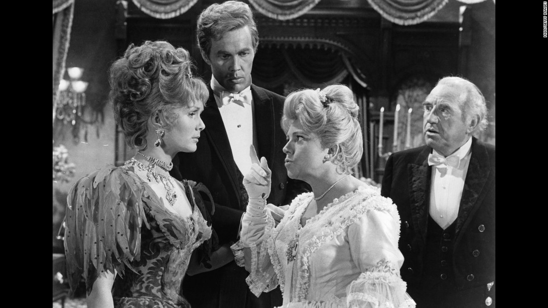 Hermione Baddeley points her finger at  Reynolds as Harve Presnell and Ed Begley watch during a scene from the 1964 film &quot;The Unsinkable Molly Brown.&quot;  Reynolds was nominated for an Academy Award for Best Actress for the role.