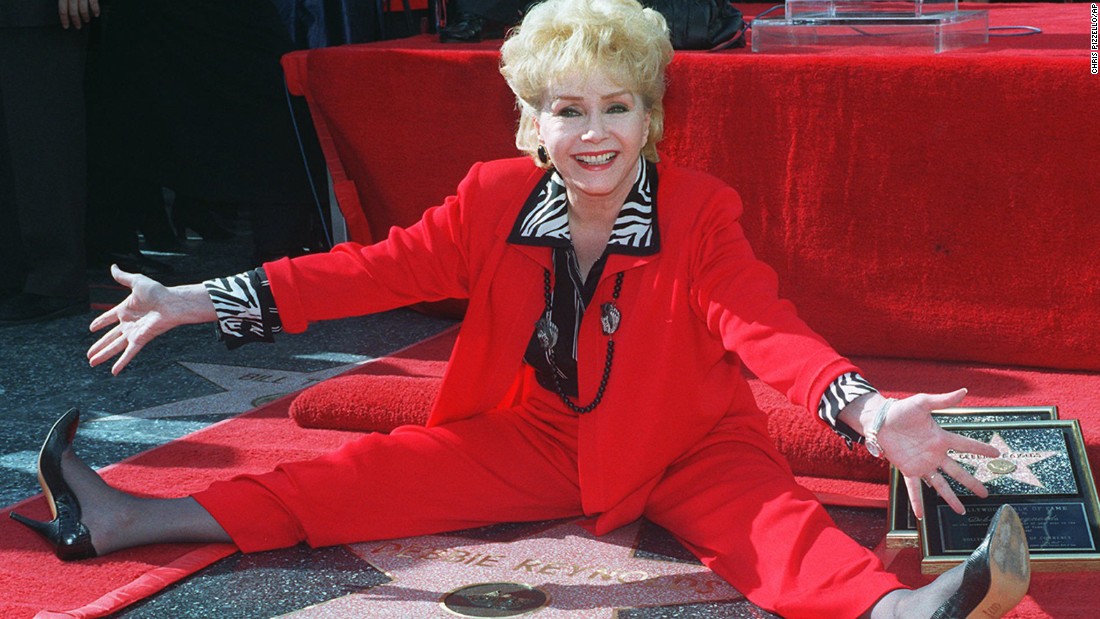 Reynolds poses with her second star on the Hollywood Walk of Fame on January 13, 1997.