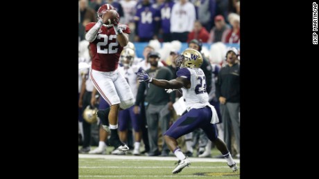 Alabama linebacker Ryan Anderson would score after picking off this pass intended for Washington running back Lavon Coleman.