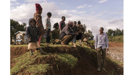 Muiruri talks with a resident of his hometown. When his true sex was revealed, Muiruri was subjected to abuse.