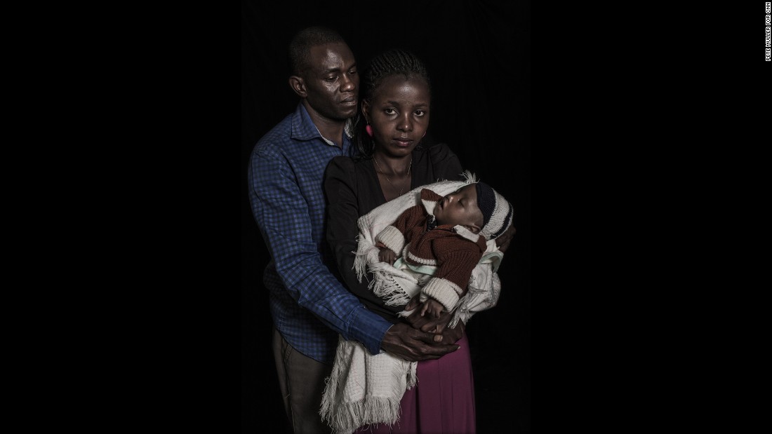 Maryann, 24, and Anthony Mwaura, 42, hold their one-year-old child who has an intersex condition as well as spinal problems. The couple says they are working to raise around US$300 to pay for a chromosomal test which they hope will determine his condition and identify a likely sex in which to raise their child.