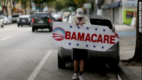 MIAMI, FL - FEBRUARY 05: Pedro Rojas holds a sign directing people to an insurance company where they can sign up for the Affordable Care Act, also known as Obamacare, before the February 15th deadline on February 5, 2015 in Miami, Florida. Numbers released by the government show that the Miami-Fort Lauderdale-West Palm Beach metropolitan area has signed up 637,514 consumers so far since open enrollment began on Nov. 15, which is more than twice as many as the next large metropolitan area, Atlanta, Georgia.