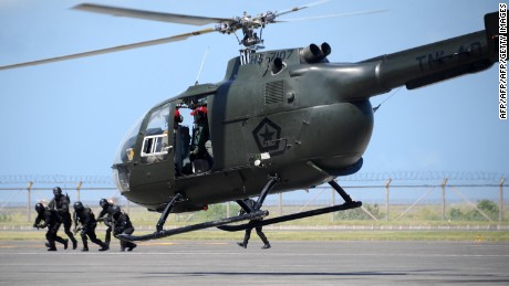 Indonesia special forces participate in an anti-terror drill in Ngurah Rai International airport in Kuta, Denpasar on the island of Bali, on September 28, 2010. 