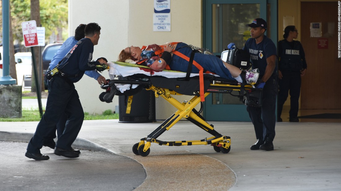 A shooting victim is taken into Broward Health trauma center in Fort Lauderdale. Eight people were being treated there after they were injured at the airport, officials said.