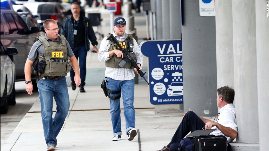 Law enforcement officers arrive at the Fort Lauderdale-Hollywood International Airport. 