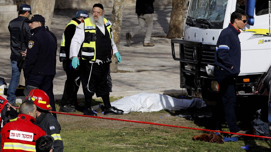 The white truck at right was the one used in the attack.