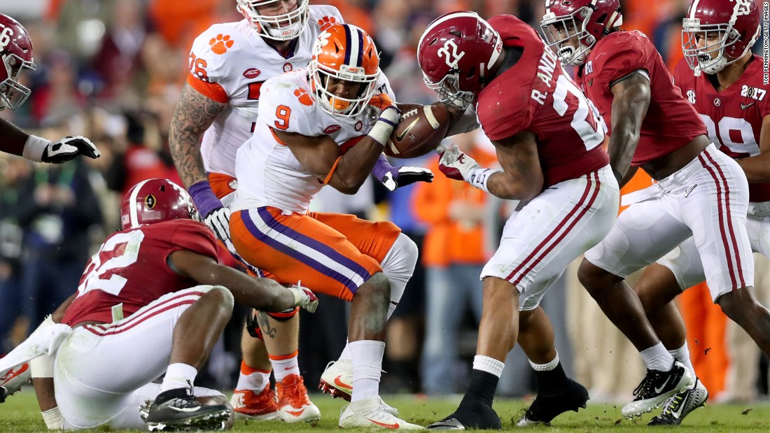 Alabama linebacker Ryan Anderson strips Gallman in the third quarter. The turnover led to an Alabama field goal and a 17-7 lead.
