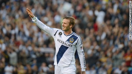 David Beckham waves to fans as he walks off the pitch after the Los Angeles Galaxy defeat the Huston Dynamo in the Major League Soccer (MLS) Cup, December 1, 2012 in Carson, California. It was Beckham&#39;s last game with the Galaxy. AFP PHOTO / Robyn Beck        (Photo credit should read ROBYN BECK/AFP/Getty Images)