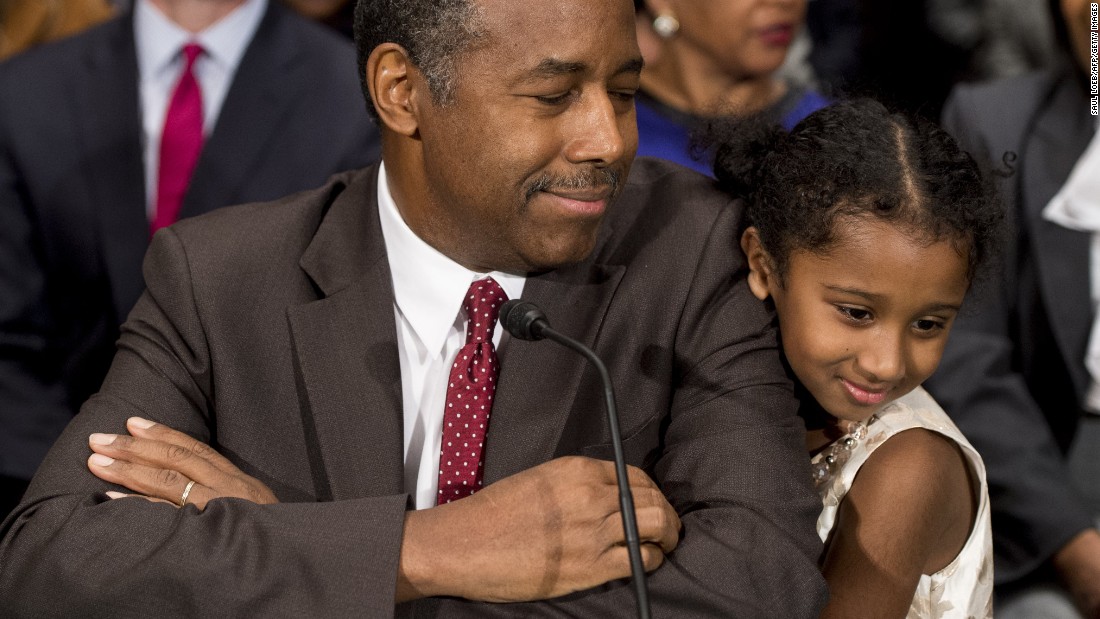 Carson greets Tesora prior to testifying before the Senate Committee of Banking, Housing and Urban Affairs in January. &lt;a href=&quot;http://www.cnn.com/2017/01/12/politics/ben-carson-hud-confirmation-hearing/&quot; target=&quot;_blank&quot;&gt;In his opening statement,&lt;/a&gt; he noted that he was raised by a single mother who had a &quot;third-grade education&quot; and made the case that he understands the issues facing the millions of people who rely on HUD programs.